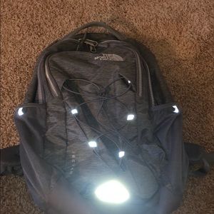 Grey woman’s north face book bag